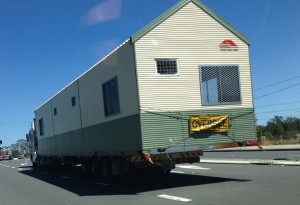 Multi-purpose shed being delivered